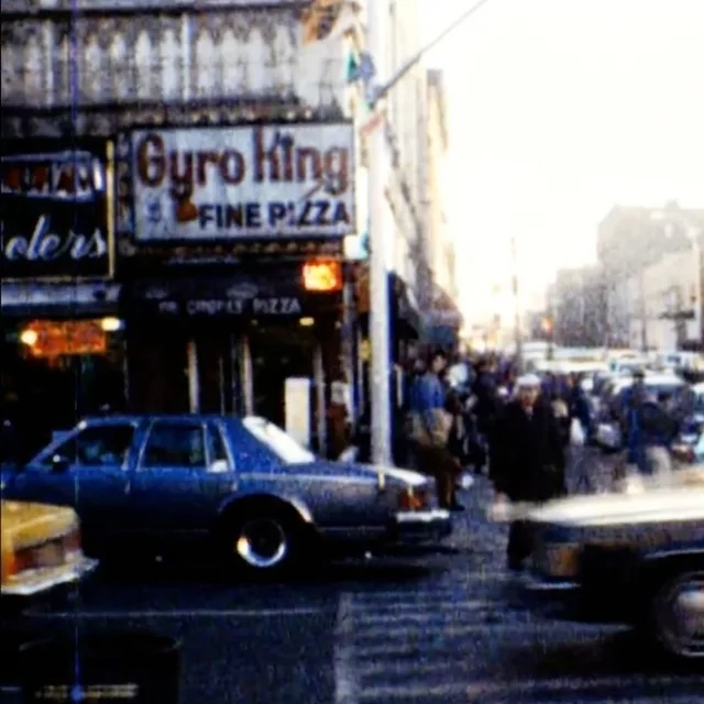 Film still of the Gyro King sign over East Fordham Road at Walton Avenue, from Bronx home-movie footage of the 1970s and ’80s